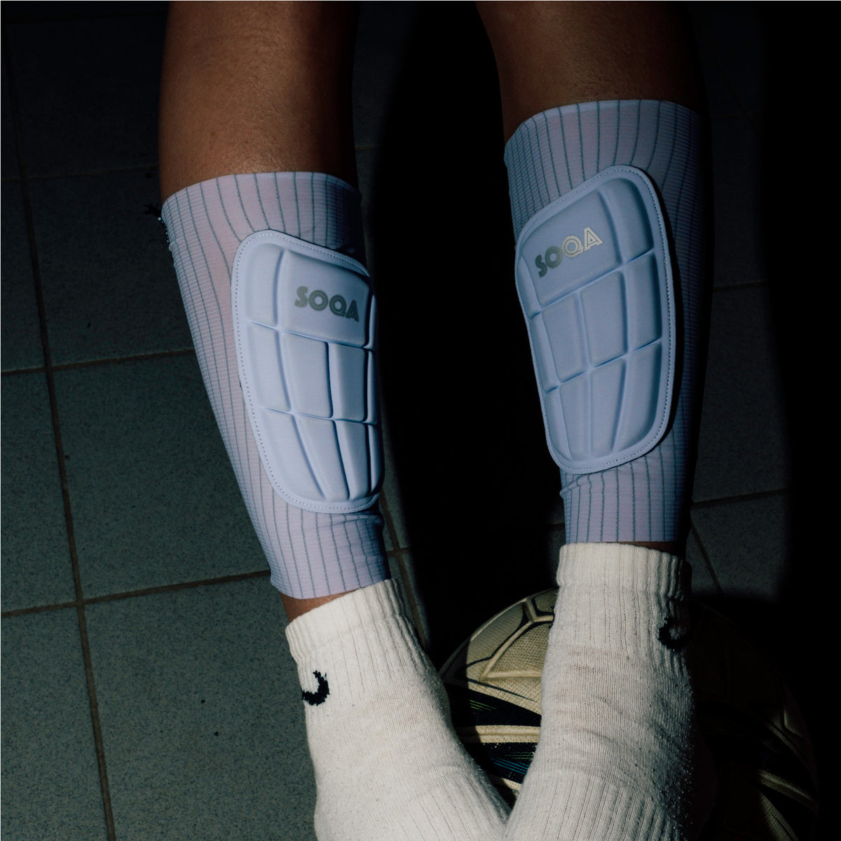 SOQA Tibia flexible football shin guards with protective pads and integrated compression sleeves